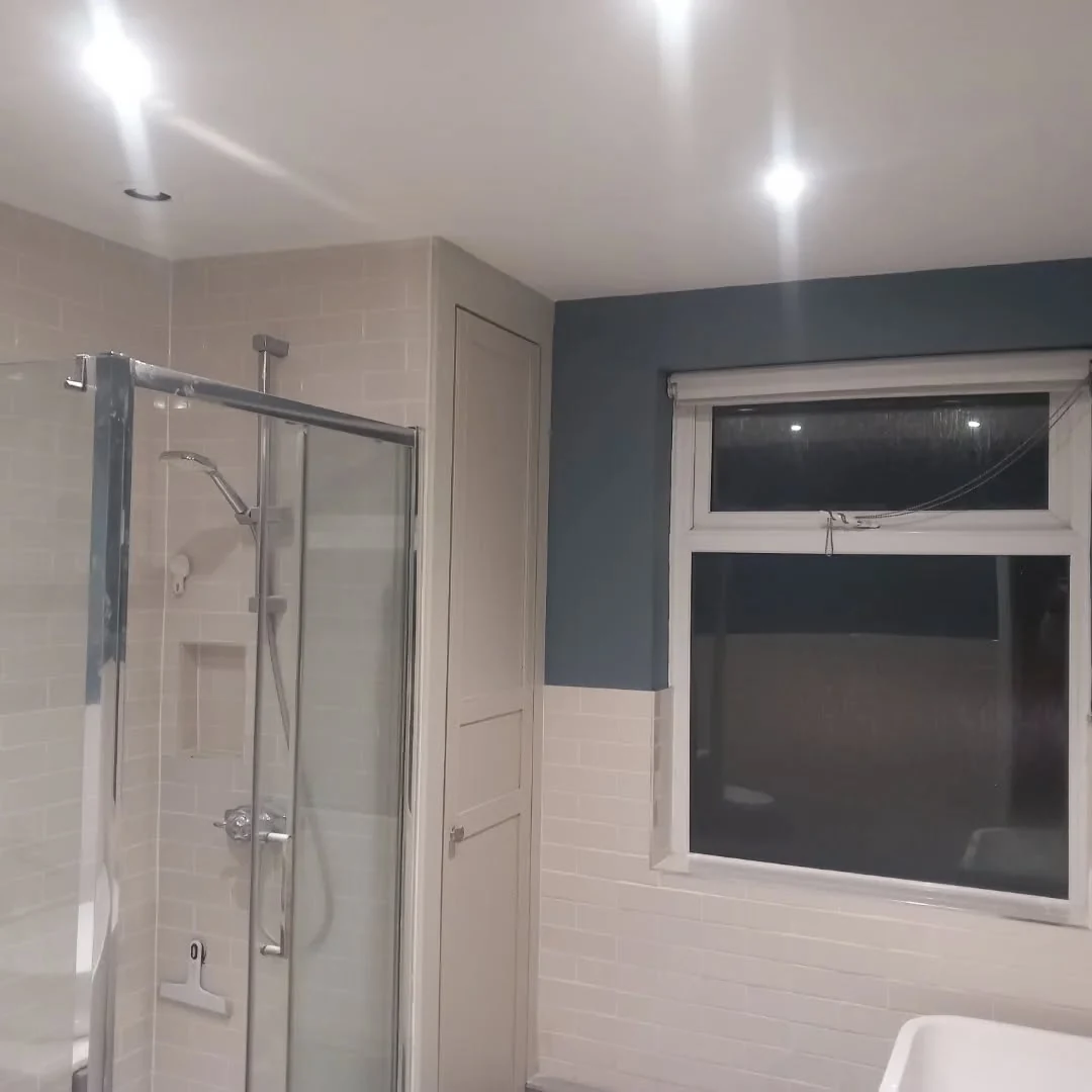 Blue-grey bathroom professionally painted by Durham Painters