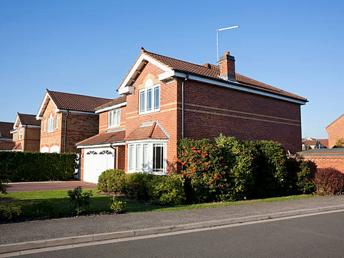 Red brick detached house exterior painting in Langley Park, Durham Painters