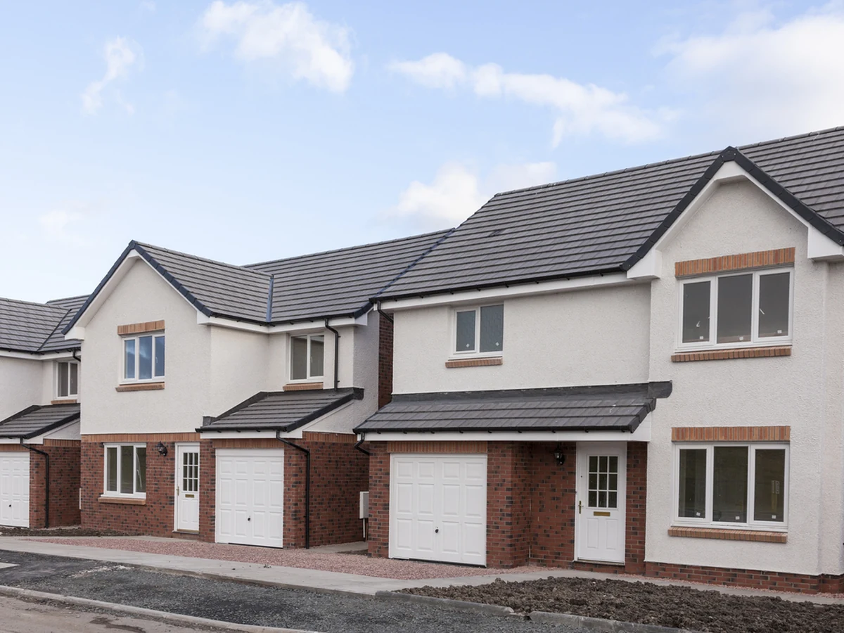 Exterior painting of a row of white rendered houses in Spennymoor by Durham Painters