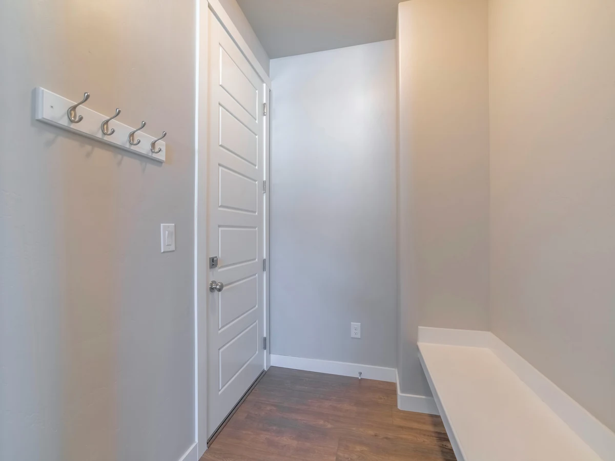 hallway-painting-grey-mudroom-door-durham-decorators Interior door painting in Durham - grey mudroom door finished by Durham Painters