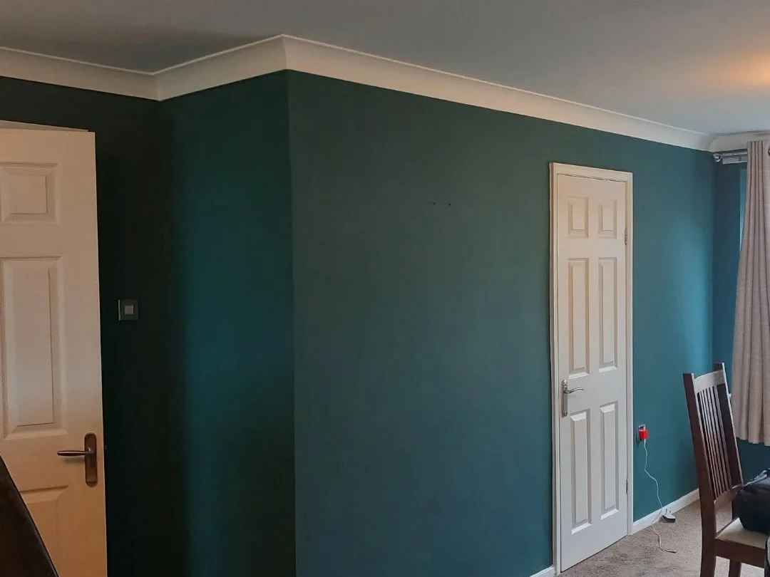 Teal dining room professionally painted by Durham Painters