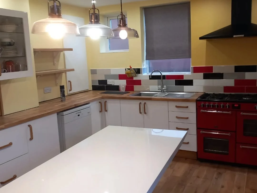 Yellow family kitchen professionally painted by Durham Painters