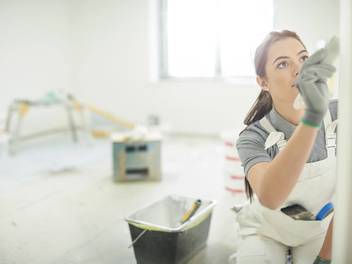 Painters and decorators in Spennymoor by Durham Painters, female painter smoothing a wall