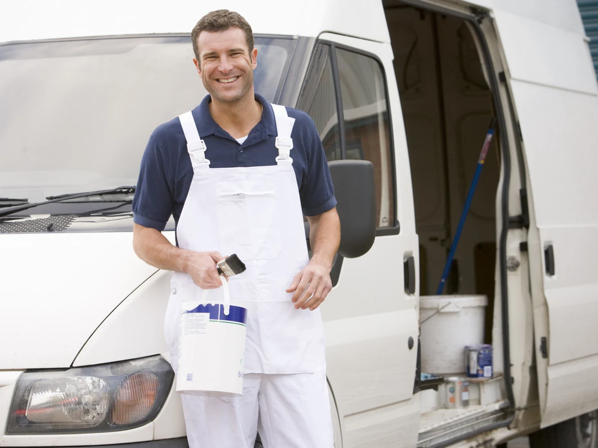 Smiling painter and decorator working in Durham